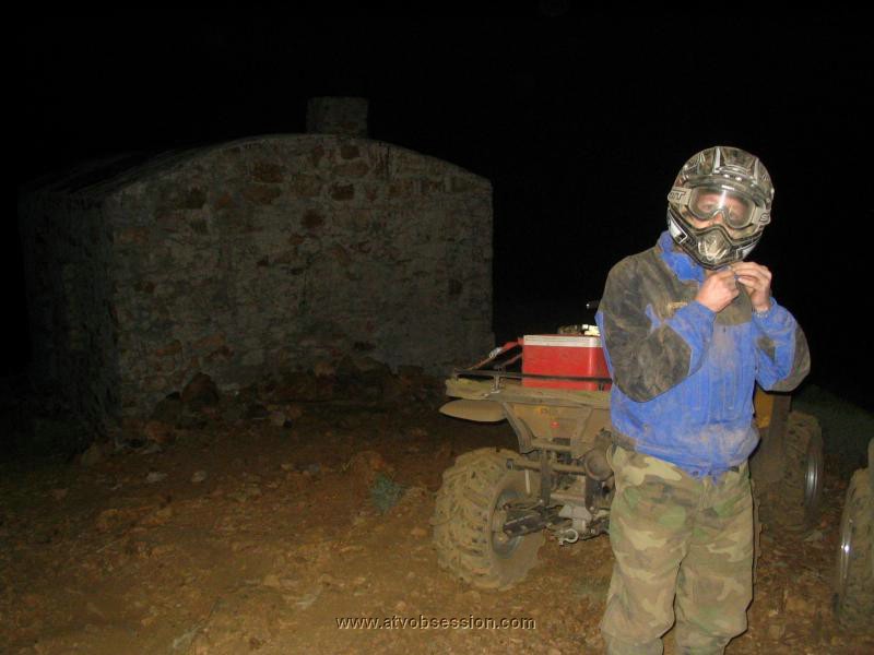 48. Terry with the Signal Peak hut in the background...you just ignore the black cliffs on each side..jpg