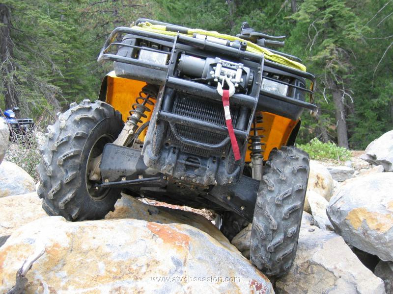 07. Ken stops on rock to show clearance...thank god for IRS.jpg