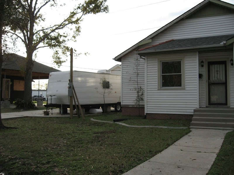 44. A typical sight...moldy house and them living in a FEMA trailer..jpg