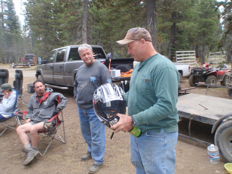 102. Larry holds Terry's helmet in memory..jpg