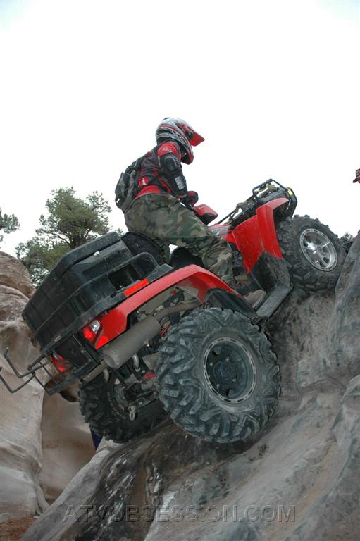 097. Even though I'm hanging 10 feet in the air, on a 900lb ATV by strand of plastic rope..jpg