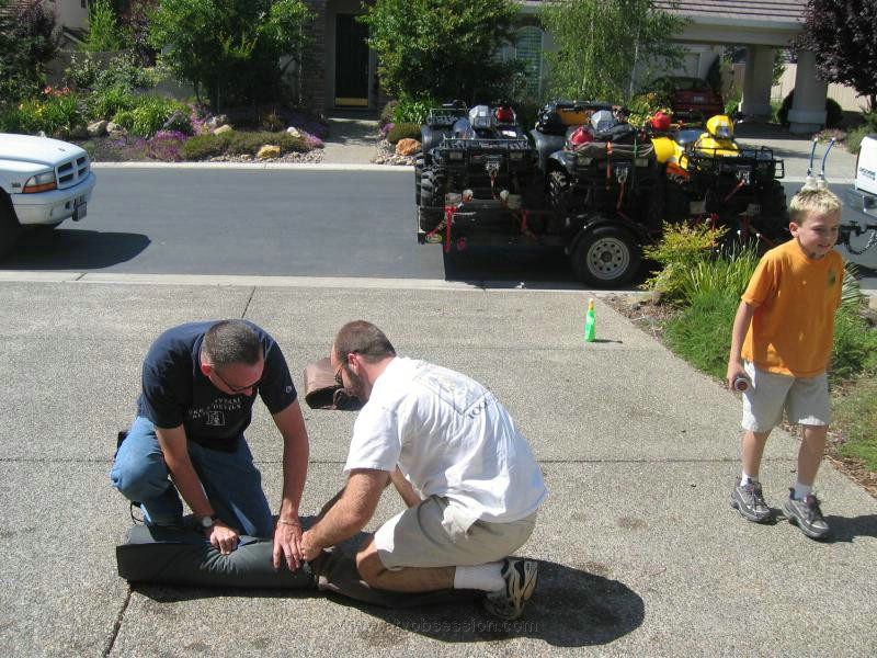 141. Terry and Dusty roll up my stuff for me...Mow my lawn next..jpg